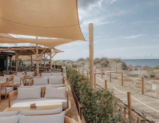 Picture of a beach club restaurant terrace overlooking the sand dunes on teh beach in marbella